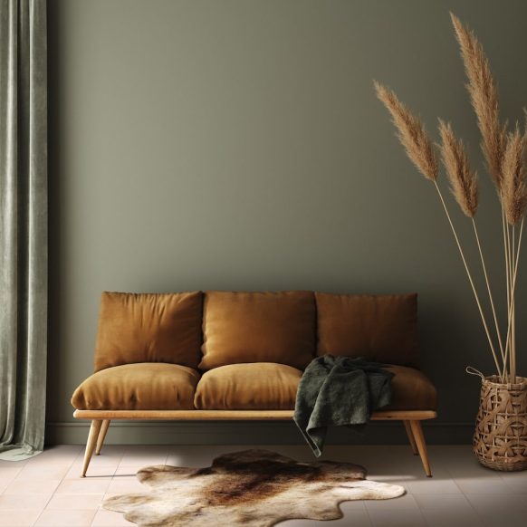 Modern dark green home interior with brown couch and pampas in wicker basket, 3d render